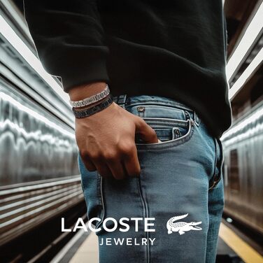 Спортивний браслет Lacoste Metropole сріблястого кольору з візерунком petit piqué та застібкою-затискачем, унісекс